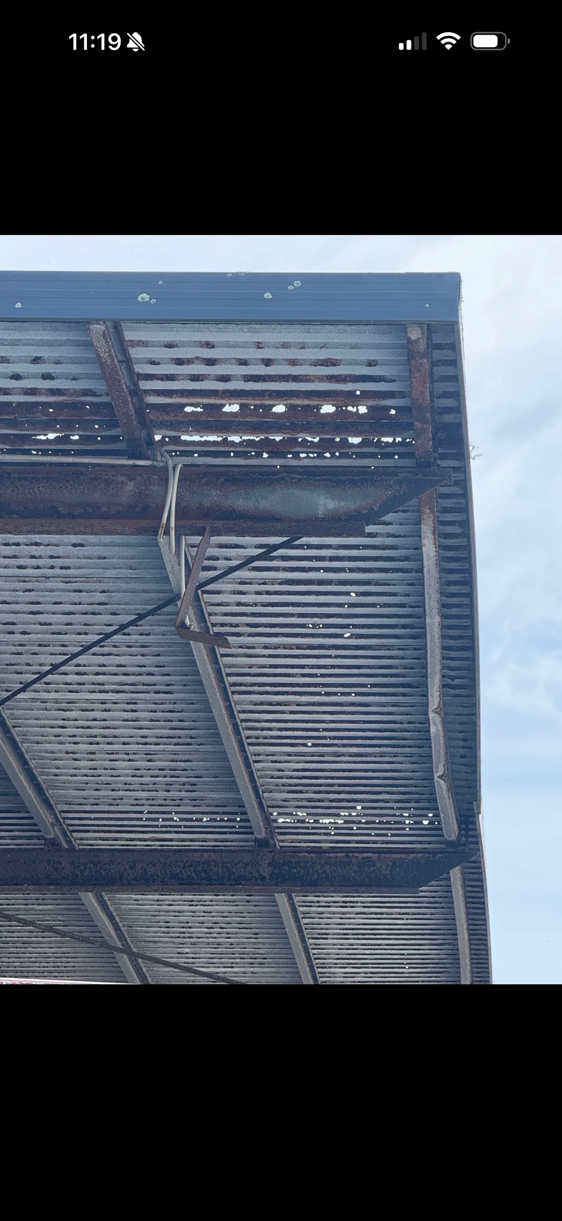 Before: underside of the original canopy showing corrosion