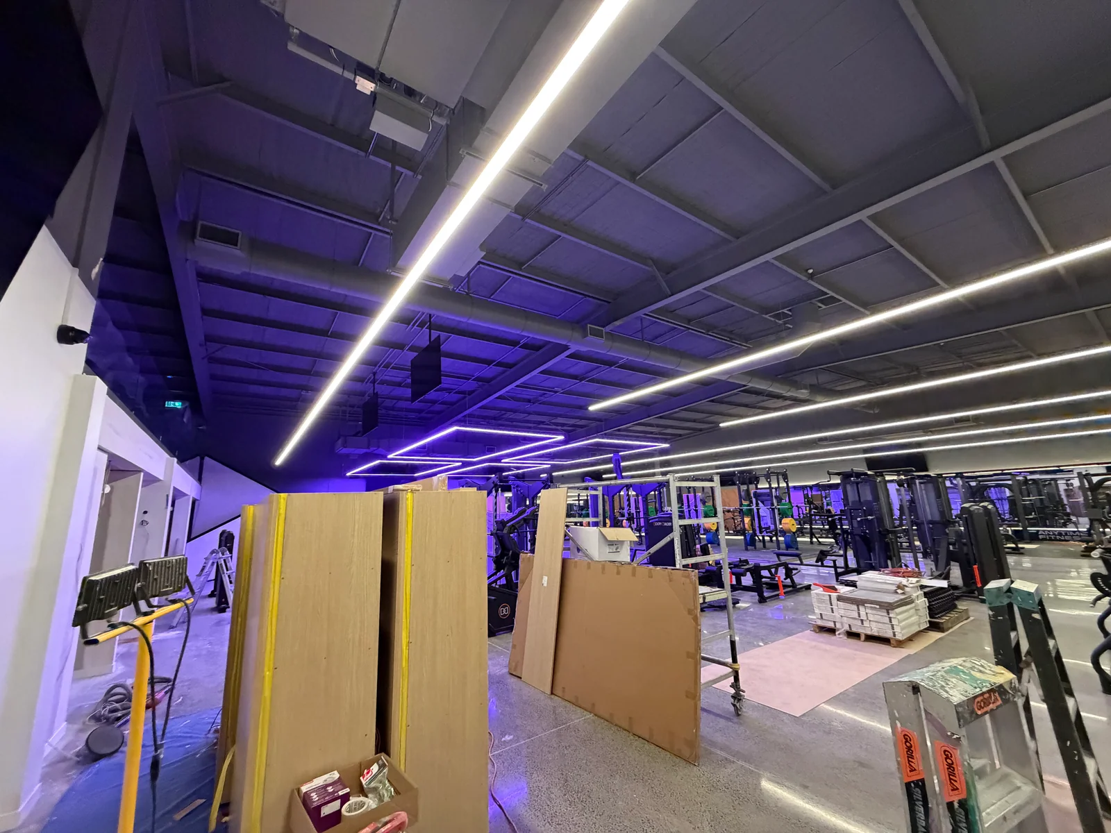 Gym interior and ceiling with lighting installed during the fit-out