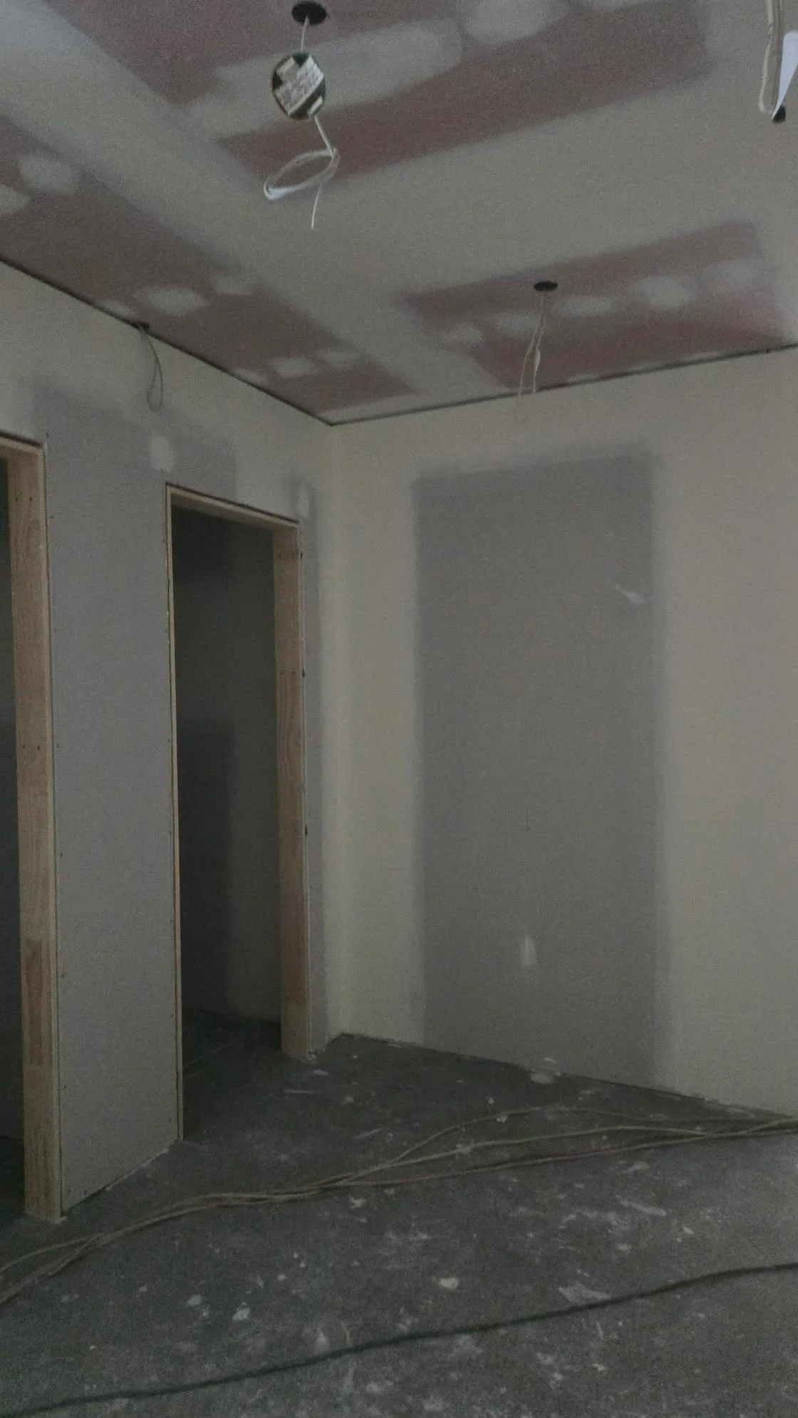 Plastering in progress: wall, doorway and ceiling preparation before painting
