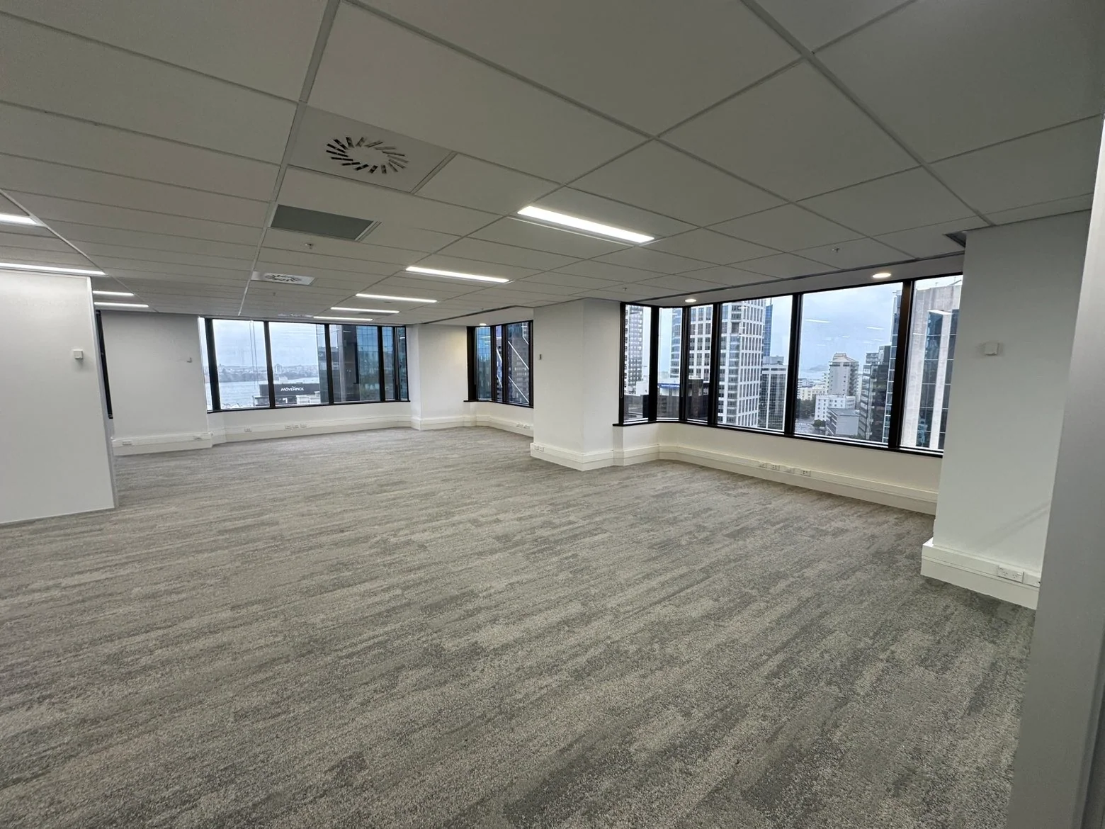 Office refurbishment with fresh white walls and perimeter windows