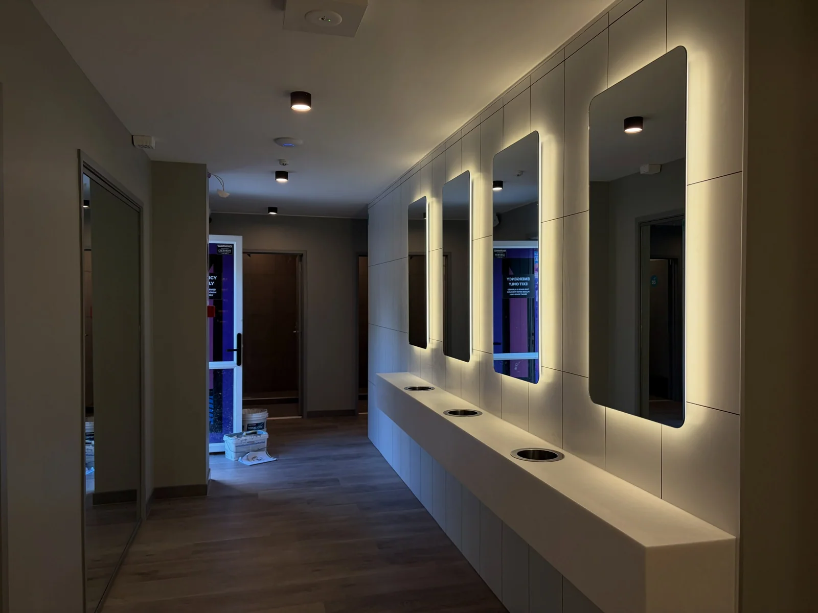 Finished bathroom corridor with painted walls and ceiling
